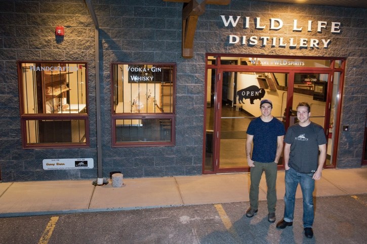 Wild Life Distillery partners Keith Robinson, right, and Matt Widmer outside their Bow Meadows location in Canmore.