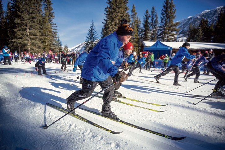 Dretin Goodstoney, centre, of the Nakoda Nordic Lost Wolves takes off from the starting line during the Foothills Cross Country Ski Club Cookie Race at the Pocaterra Hut in