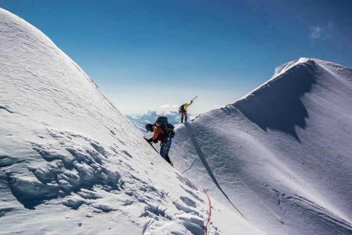 Climbers negotiate the summit ridge on the South Twin at the Columbia Icefield.