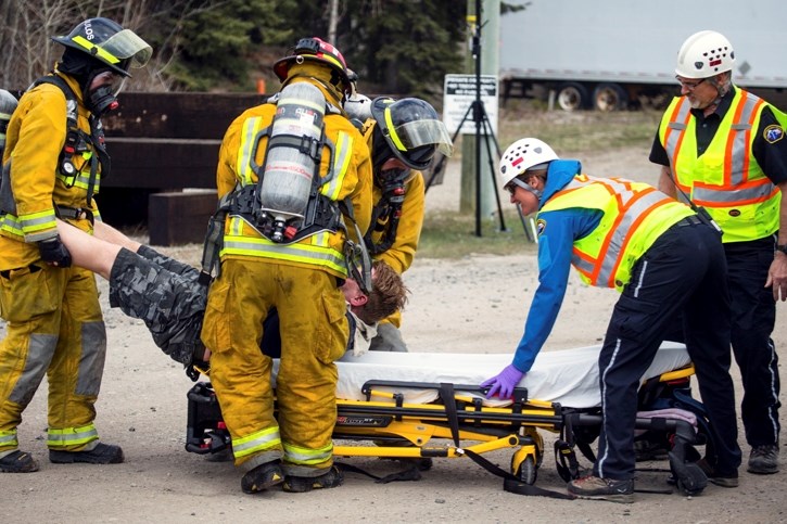 Firefighters and EMS work side by side during a mock disaster exercise in Banff on Wednesday (May 10). Somer emergency responders in the Bow Valley have expressed concern the 