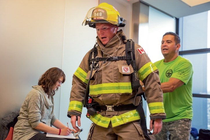 Kevin Buchanan of the Lake Louise Fire Department competes in the firefighter stair climb challenge at The Bow in Calgary on Sunday (May 7). Over 500 firefighters, including