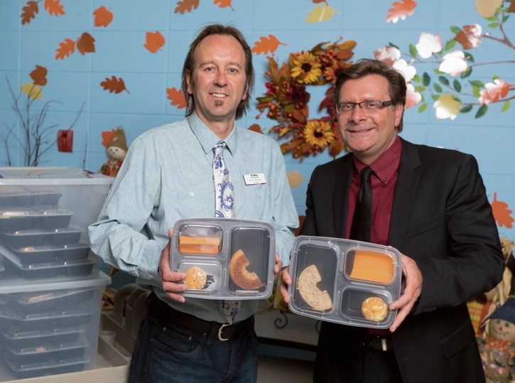 Canadian Rockies Public Schools superintendetn Chris MacPhee (left) and Elizabeth Rummel Elementary School principal Brian Wityshyn with the nutrition program’s mid-morning