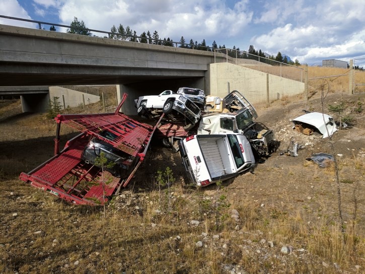 The remains of a crashed car carrier truck aside a wildlife underpass in Banff.