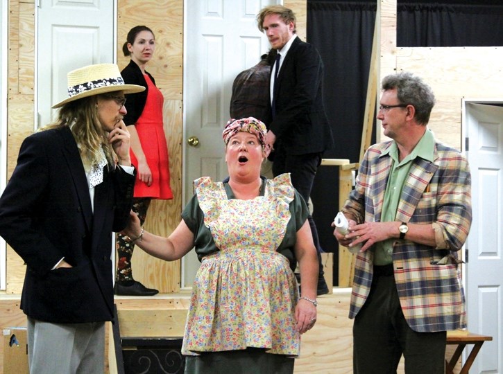 Part of the cast of Noises Off rehearses at the Canmore Miners Union Hall, Thursday (Nov. 2). At rear are Candise McMullin (Brooke) and Marcus Williams (Garry) with John