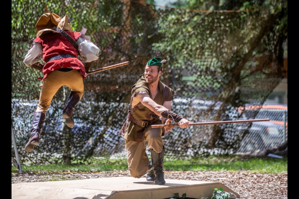Robin Hood, played by Scout Hogg, jumps over the staff of Little John, played by Brian McDonald, during a performance of Robin Hood: Prince of Outlaws at the Stan Rogers Stage in Canmore on Thursday (July 11). The production is part of the Canmore Summer Theatre Festival, put on by Pine Tree Players and Artists' Collective Theatre, and runs from July 10 to 21. ARYN TOOMBS RMO PHOTO