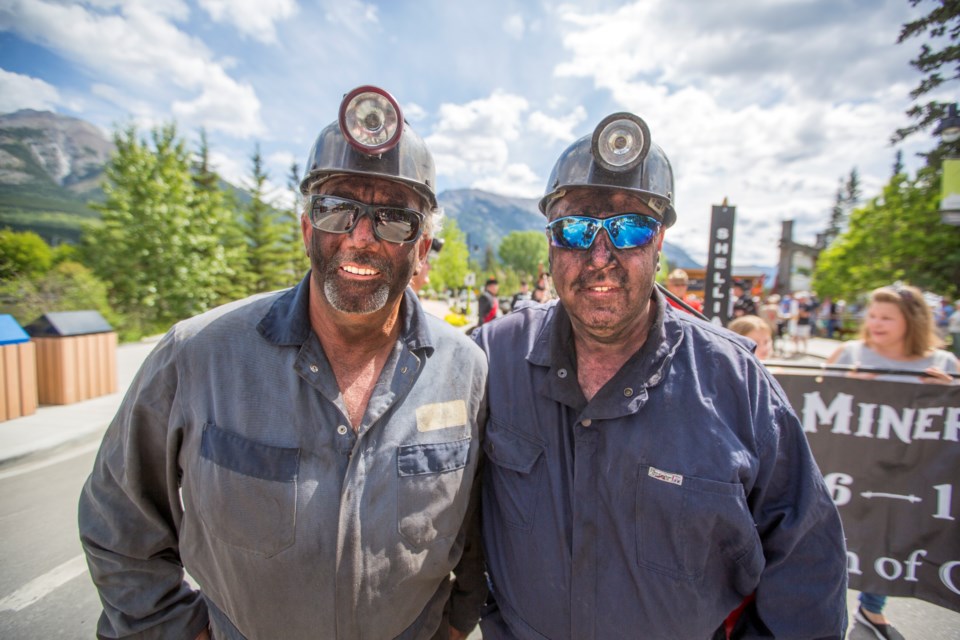 Larry Anderson, left, and Rob Bushulak head up the annual Miners' Day Parade in Canmore on Saturday (July 13). This year marks the 40th anniversary of Black Friday, the day the mines closed. ARYN TOOMBS RMO PHOTO