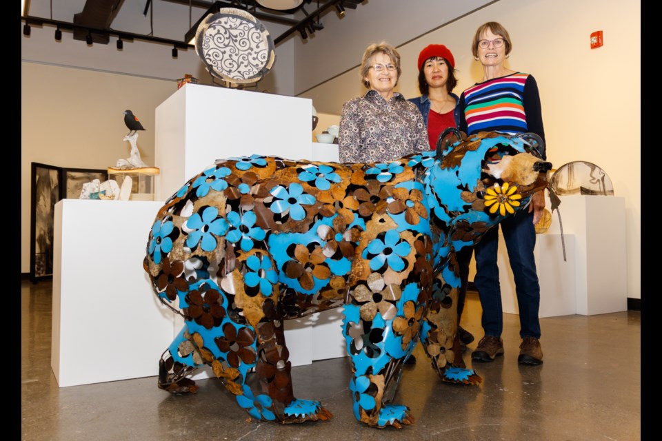 Bow Valley artists Lynne Kemshead, left, Kari Woo and Off the Wall founder Priscilla Janes show off a selection of art on display at the CAG Gallery in Elevation Place on Thursday, Nov. 7, 2019. CHELSEA KEMP RMO PHOTO