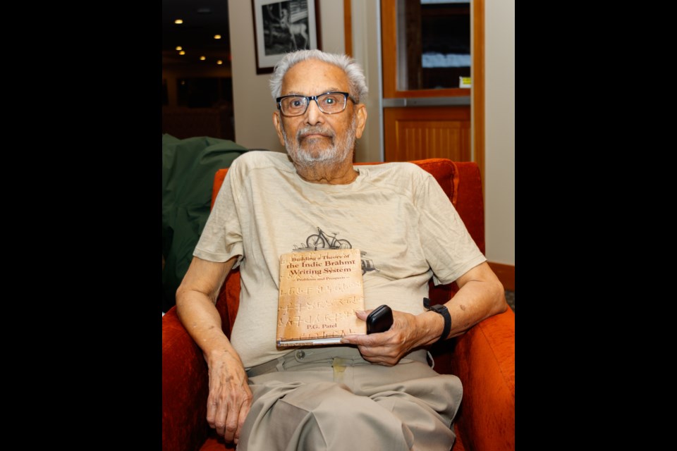 Purushottam Patel holds his latest book. SUBMITTED PHOTO 