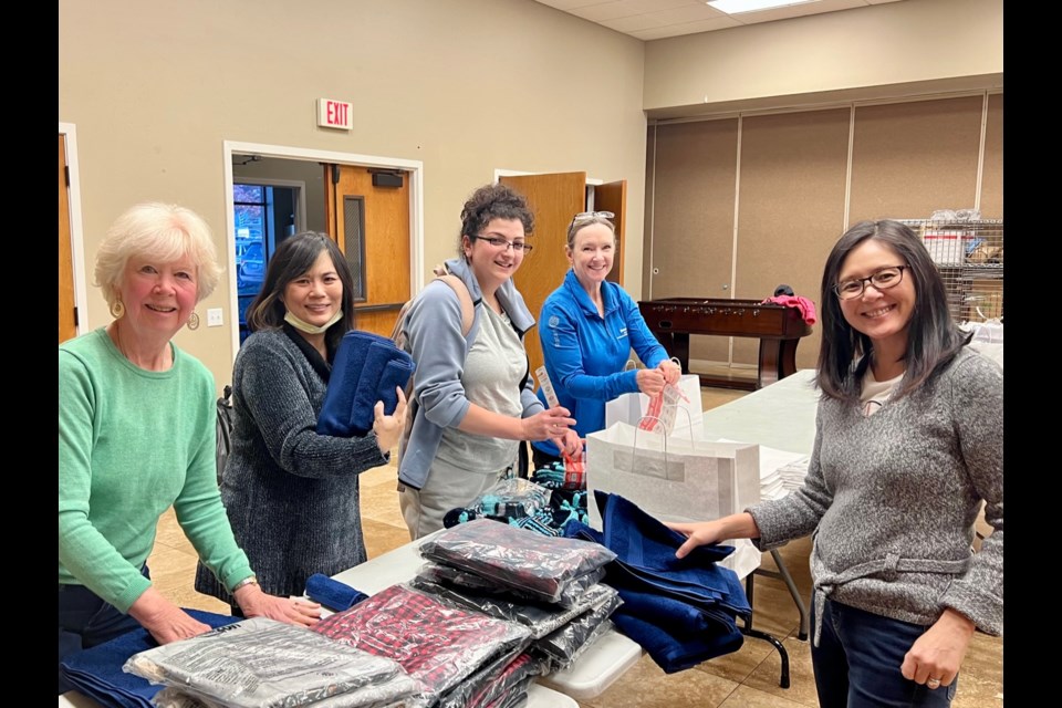 The Rotary Club of Redwood City, Peninsula Starlight, San Mateo Sunrise and San Francisco West, and individual donors joined together to provide 24 bags of sheets, towels, pajamas, warm socks, toothpaste and toothbrushes for CORA (Community Overcoming Relationship Abuse). 