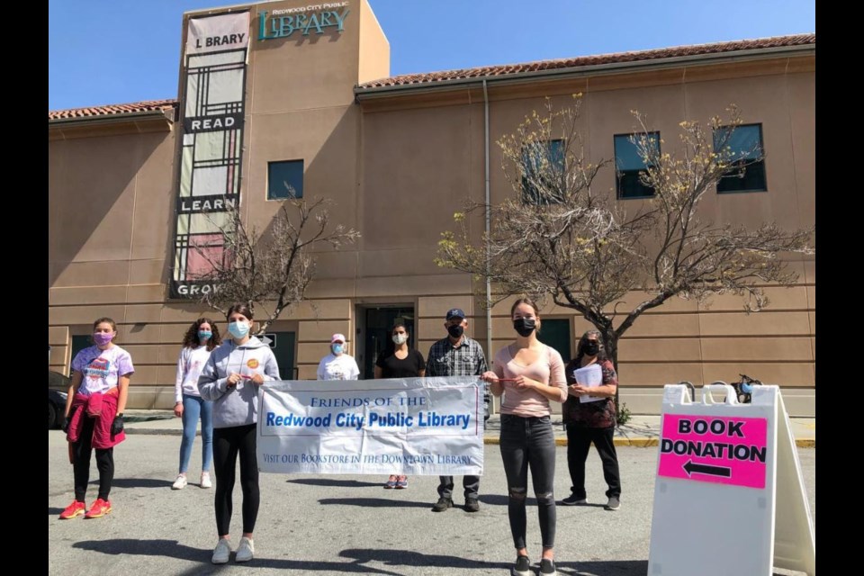 Pictures of the people working a donation event behind the library from a few months back 