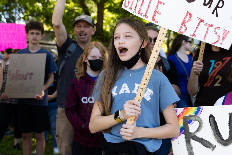 Zoe, 12, chants during the "Bans Off Our Bodies" rally in downtown Mountain View on May 14, 2022. 