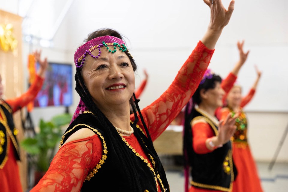 A dancer performs at the Lunar New Year celebration hosted by Avenidas Chinese Community Center at Cubberley Community Center in Palo Alto on Jan. 26, 2023. Photo by Magali Gauthier.
