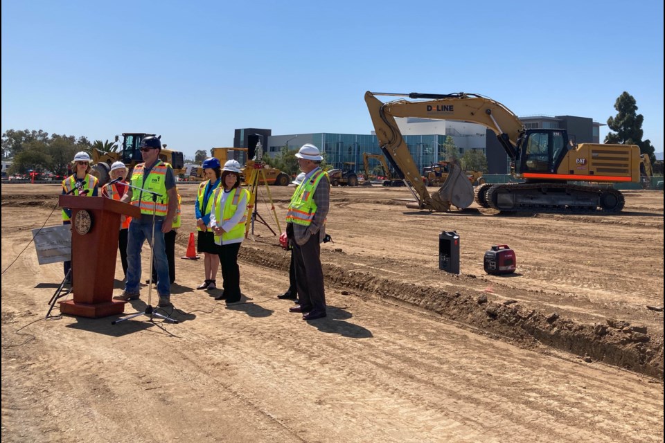 Rep. Jackie Speier, second from right, stands at the construction site for San Mateo County's navigation center in Redwood City, Calif. after presenting a check for the $500,000 grant she secured towards the project.  