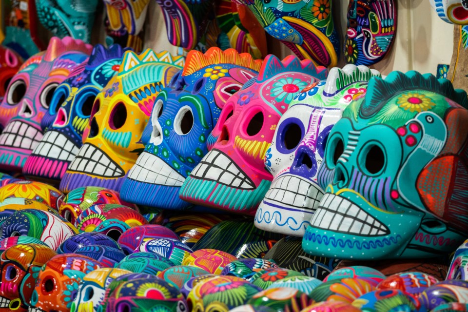 San Miguel de Allende, Mexico - January 13, 2019: Decorated colourful skulls at street market in San Miguel de Allende, Mexico, Day of Dead (Dia de los Muertos) concept.