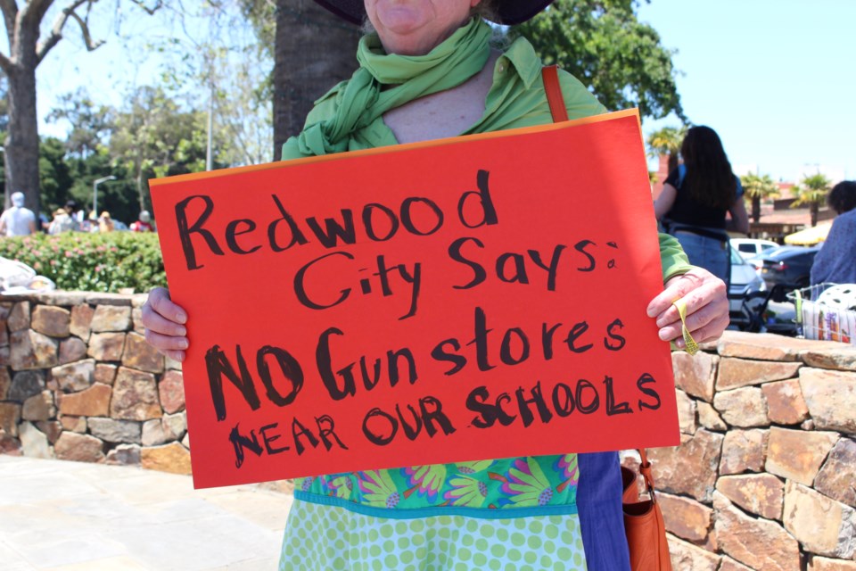 Ruth Robertson of Raging Grannies Action League protests outside Town and Country Village on May 13, 2023. Photo by Avery Luke.