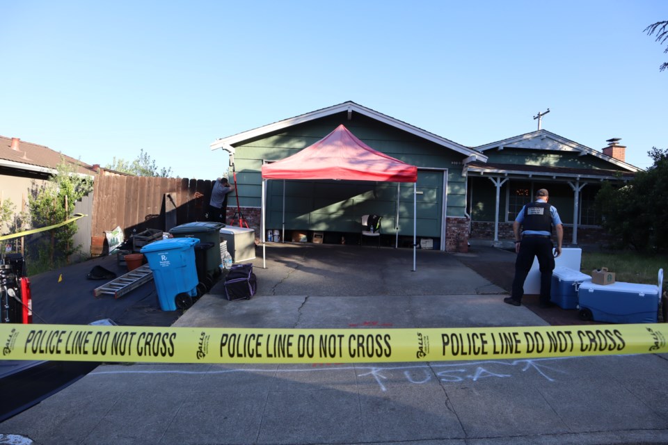 Crime scene investigators on Wednesday, May 10, 2023, search for evidence at a home in the 3700 block of Farm Hill Boulevard. Photo by Avery Luke