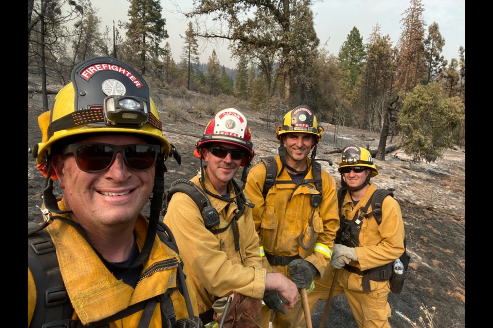 Captain Brian Steach (second from left) with his crew