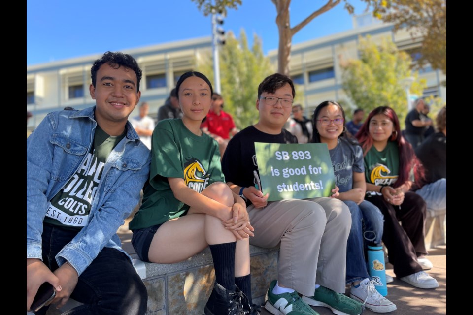 Noah Liu (third from left), commissioner of publicity for the Associated Students of Cañada College, attends the rally with his peers 