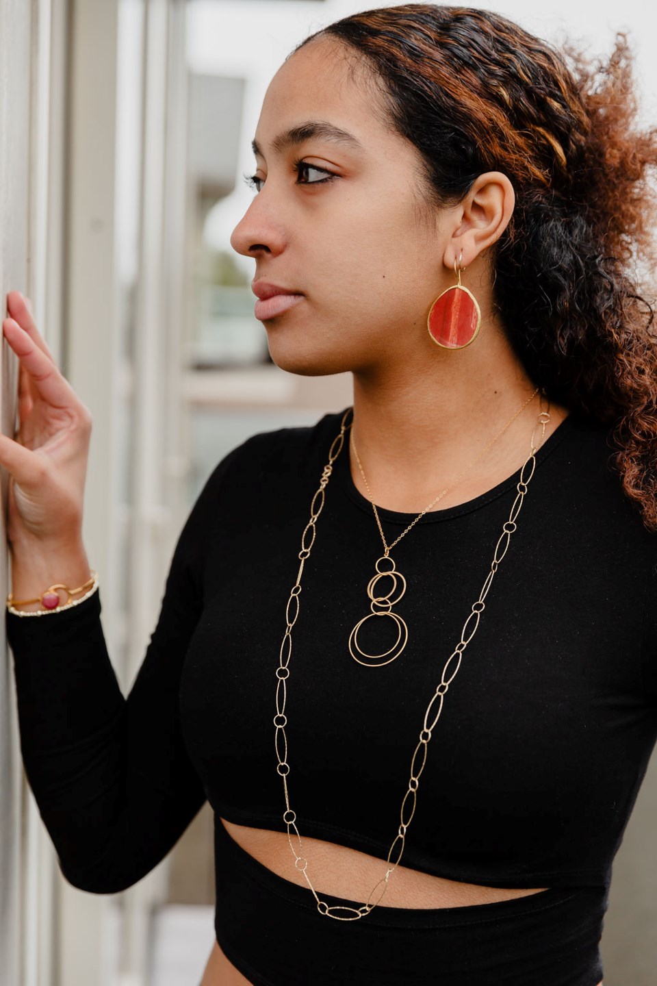 Meyla-Red Agate Slice earrings, large circel necklace and layered gold necklace on model 1.22