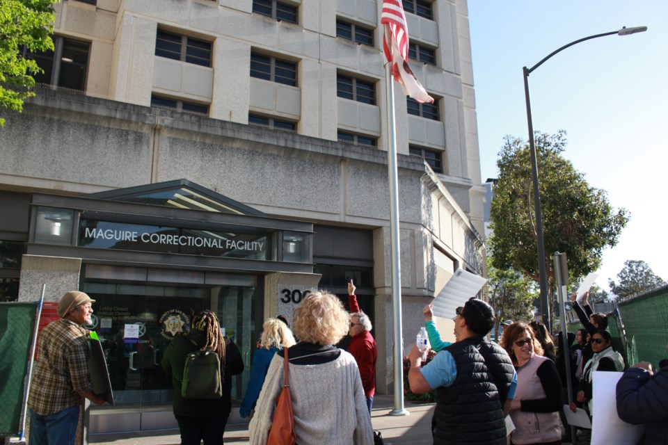 Activists call out to people incarcerated at Maguire Correctional Facility in Redwood City on April 18, 2023. Photo by Avery Luke.