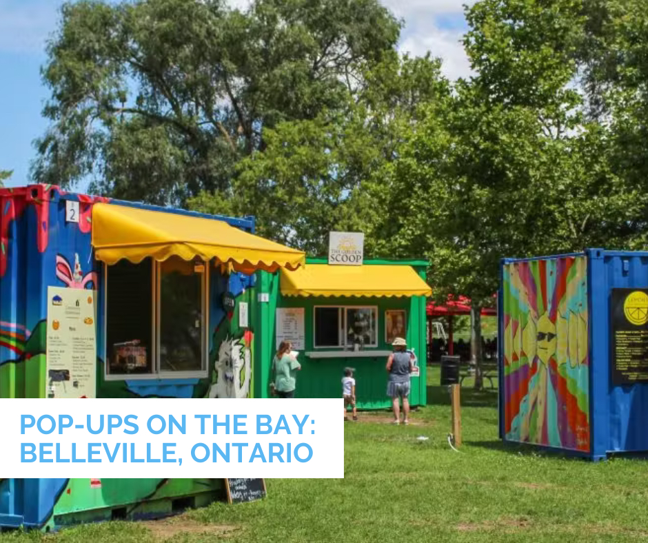 Families ordering ice cream from The Golden Scoop and exploring painted vendor booths at Pop-Ups on the Bay in Belleville, Ontario.