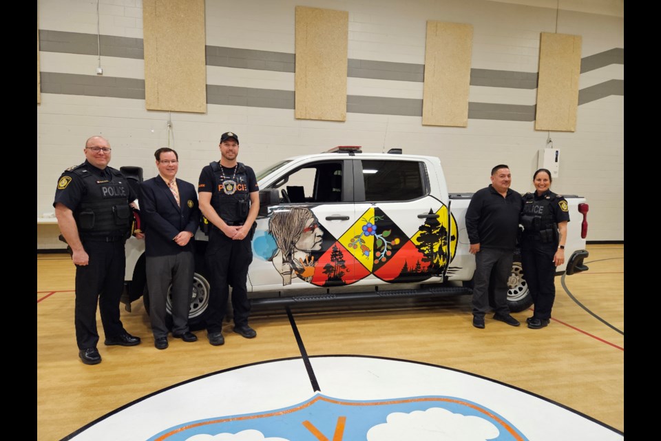 Sarnia Police Chief Derek Davis, board chair Paul Wiersma, Const. Tyler Callander, Chief Chris Plain, and Dep. Chief Julie Craddock.