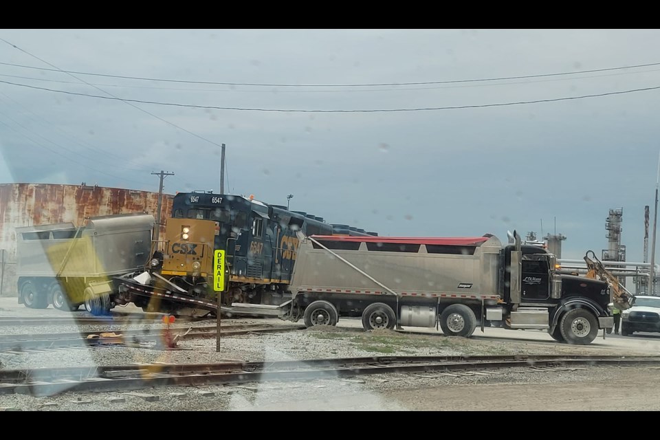 A CSX train struck a dump truck in Sarnia, Tuesday morning.