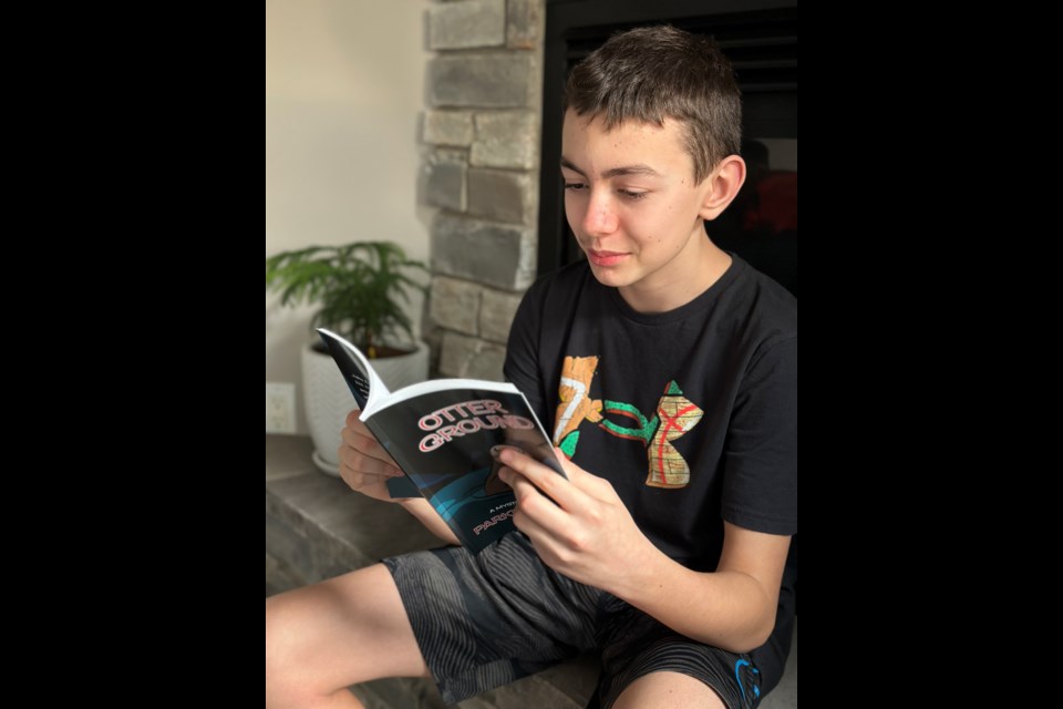 Parker Leckie, 12, has written his first novel, 'Otter Ground.'