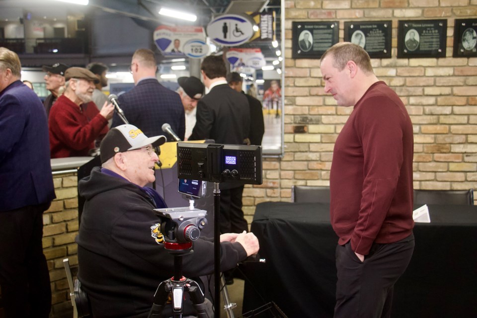 Fred Jennings, 89, takes a moment to speak with 2023 Hall of Fame Inductee Jon Sim.