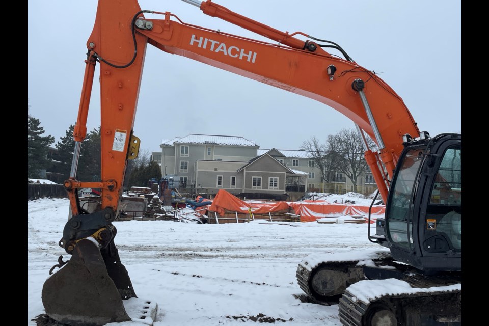 Equipment and trucks are at the construction site along London Road where Lambton County is building 24 new affordable units next to 57 others built a decade ago visible in the background.