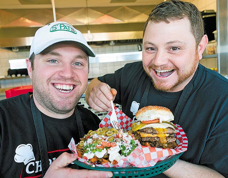 Greg and Chris Skillas with a triple custom hamburger with feta fries.