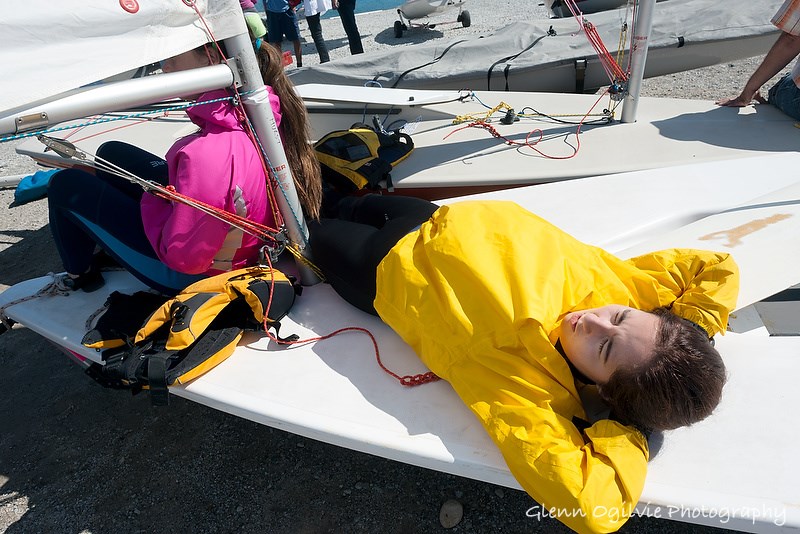 Jillian Smith, 14, and Elayna Hurst, 17, of the London Yacht Club, keep warm and rest up while waiting for the wind to rise at Sailfest Sarnia. Glenn Ogilvie 