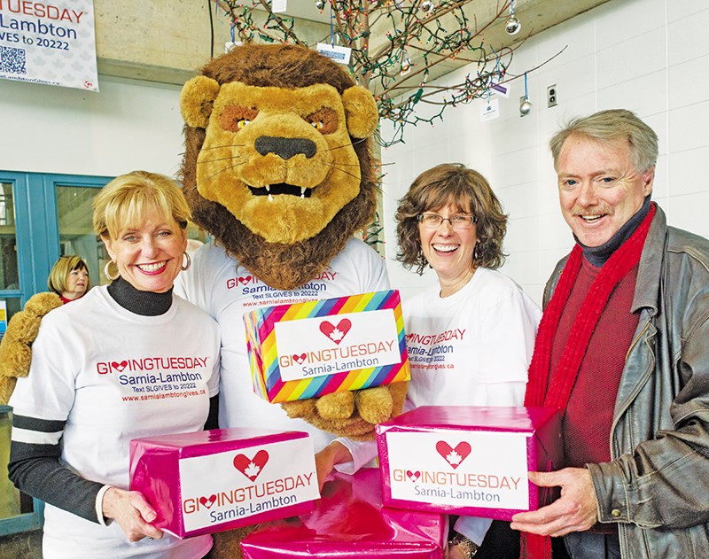 Helping kick off Giving Tuesday last week were from left; Judith Morris, president and CEO of Lambton College, organizers Jack "the tiger" Poirier and Anita Minielly, and Sarnia Mayor Mike Bradley Glenn Ogilvie