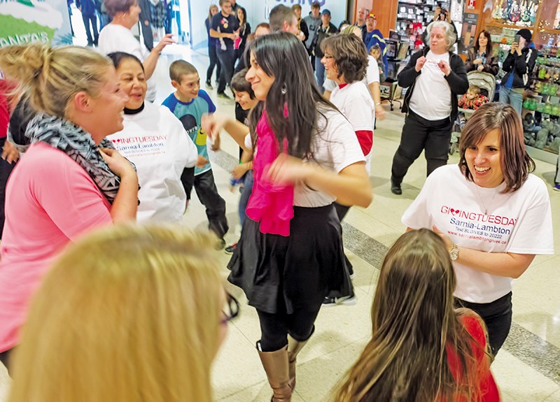 Flash mobber at Lambton Mall rally in support of Giving Tuesday and the 26 Sarnia-Lambton charities and not-for-profits it supports Glenn Ogilvie