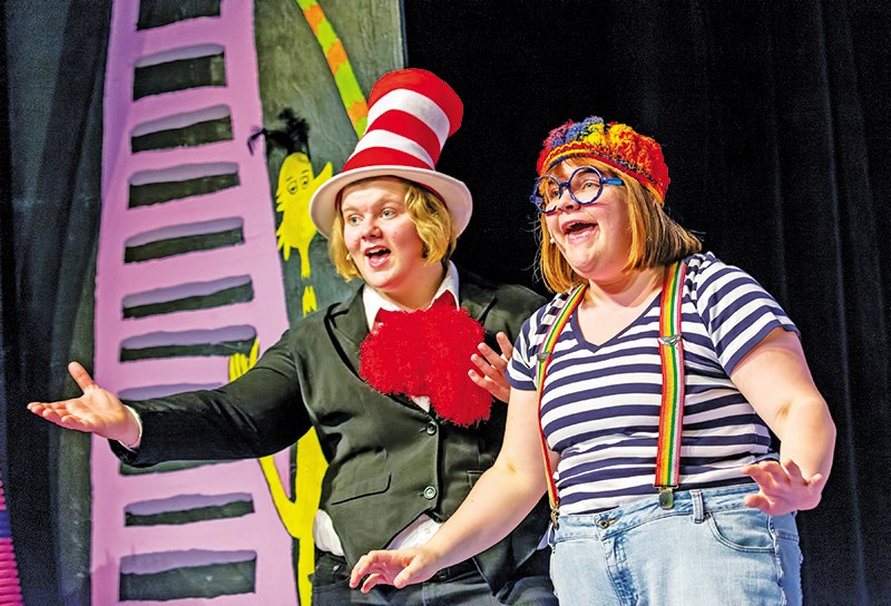The Cat in the Hat, left, played by Addie Bicum, and JoJo, played by Brenna Freer, sing with the cast during a dress rehearsal for Seussical Jr. at SCITS. Glenn Ogilvie