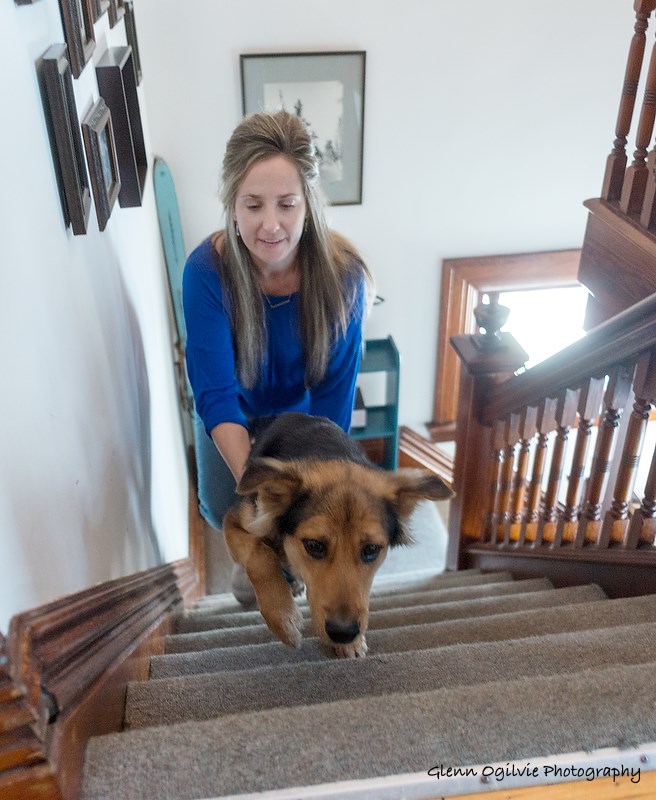 Jamie Marilyn Smith gives Leo a boost to help him get up the stairs. Glenn Ogilvie