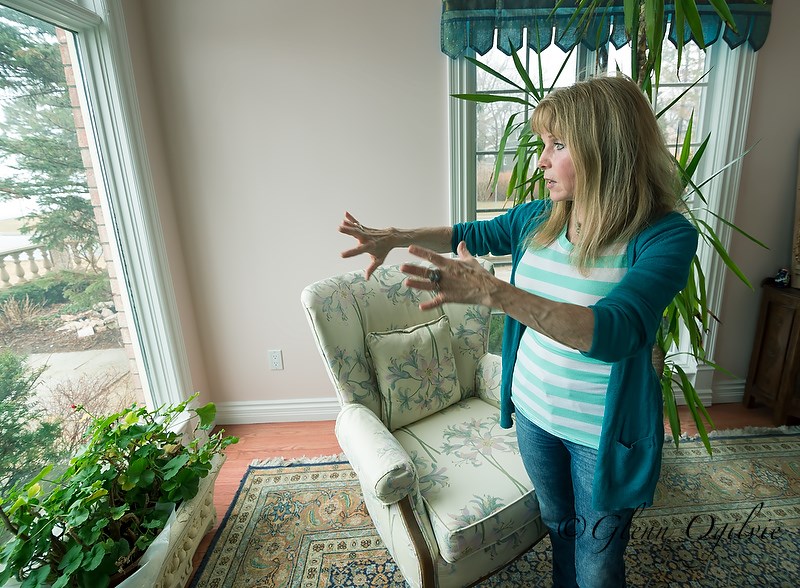 Shannon Bourke explains her home's design while standing in the northeast corner, which is aligned with the element of "water." Glenn Ogilvie