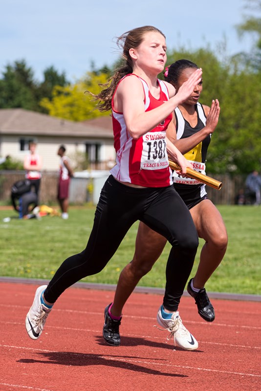 Skyla Minaker carries the baton for Northern Collegiate at the SWOSSA track and field meet, held last weekend at Chatham-Kent and Windsor. She and teammates Georgia Auger, Kristy Hodgins and Kelly Hodgins placed first in the senior girl's 4x100 metre relay with a time of 49.26. Competing as a junior, Minaker won the 80-metre hurdles, was second in long jump and fourth in triple-jump. Top five finishers in each event advanced to the all-Ontario meet in London May 29-30. Bruce Smith, Special to The Journal