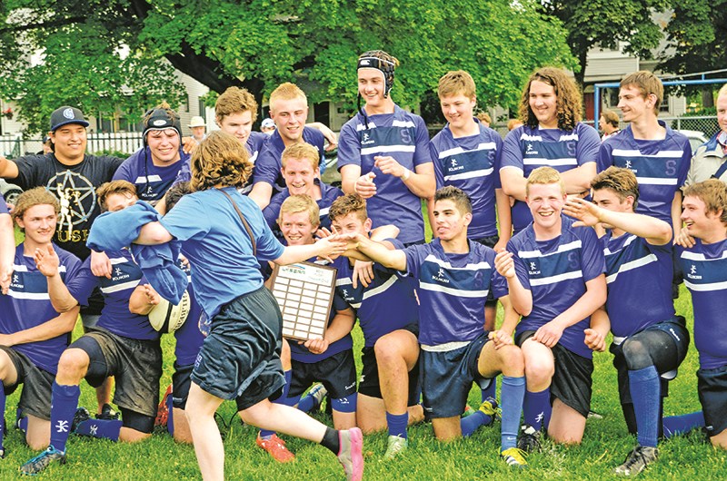 Good job, guys The jubilant senior boys team from SCITS gets a running high-five from fellow student Ashley Toulouse after winning the Lambton-Kent high school rugby championship on their home turf on May 28. The Blue Bombers defeated the St. Pat's Fighting Irish 19-5 to advance to the A/AA Ontario high school championship, which was set to begin June 4 in Barrie, Ont. In the junior boys final, Northern Collegiate downed SCITS 10-5 in overtime. Glenn Ogilvie