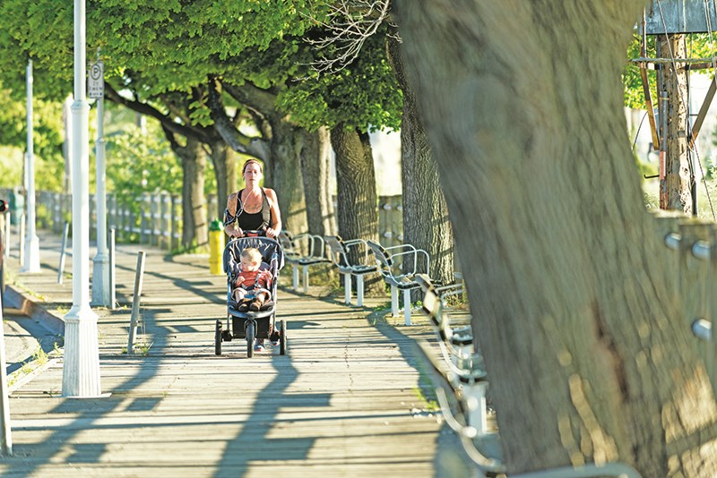 The boardwalk as it looked in July of 2014, with Casandra Cuthbert jogging along the wooden structure with her two-year-old son, Bo.  Glenn Ogilvie