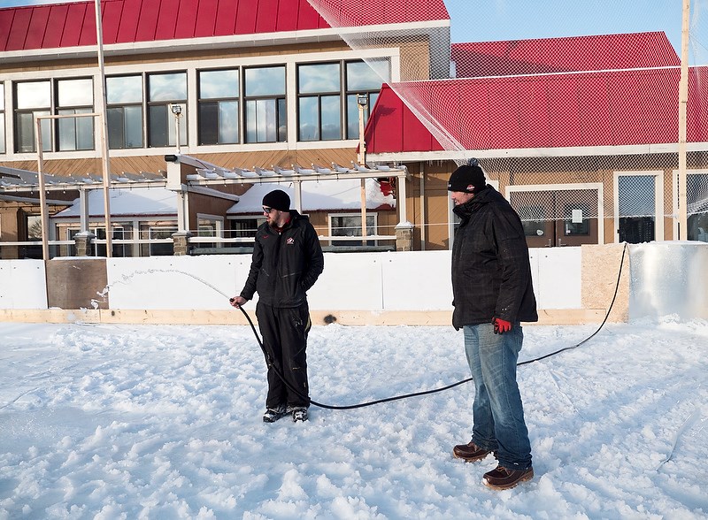 Jordan Colquhoun, left, and Graham Holmes, work on the outdoor skating rink going in at Stokes by the Bay on Harbour Road. Glenn Ogilvie