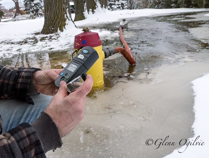 City of Sarnia worker Alex Scheibner flushes a fire hydrant while testing the water for chlorine. Glenn Ogilvie