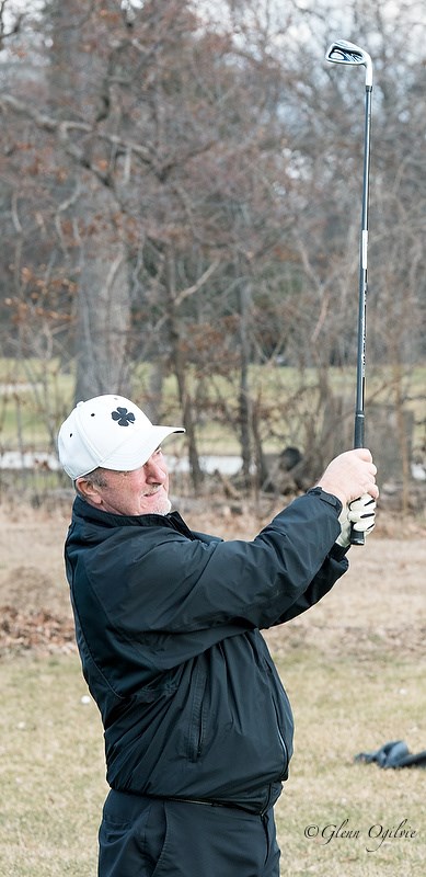 Mike Shearon keeps his eye on a ball after hitting an iron at the Sarnia Golf and Curling Club on Feb. 3.  