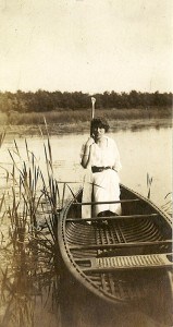 Pauline Grace, a daughter of Thomas Grace, rests in a canoe on the cattail-rimmed shoreline of Lake Chipican in this undated photo. Photo courtesy Jane Hunter