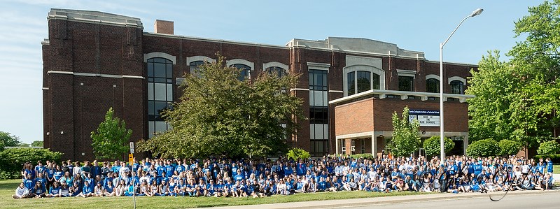 SCITS students and faculty gather for a school portrait on the front lawn during the school's final "blue and white" day on June 10.   