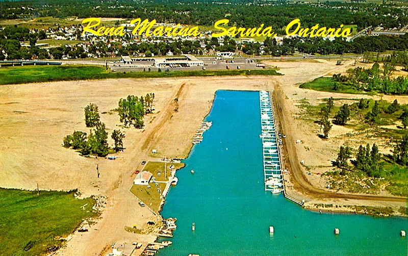 This aerial view shows "Rena Marina," which was dug from marshland in the first phase of a development that evolved into today's Bridgeview Marina and Venetian Village in Point Edward. Visible behind the new marina cut is the plaza of the Blue Water Bridge. Dave Burwell Collection, Sarnia Historical Society