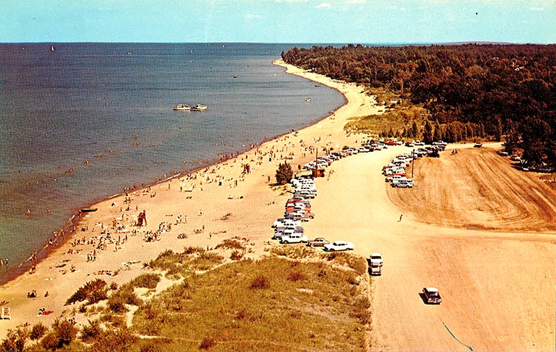 This postcard offers an aerial view of Canatara Park beach before the arrival of paved parking lots, lifeguard building and other amenities. Dave Burwell Collection, Sarnia Historical Society