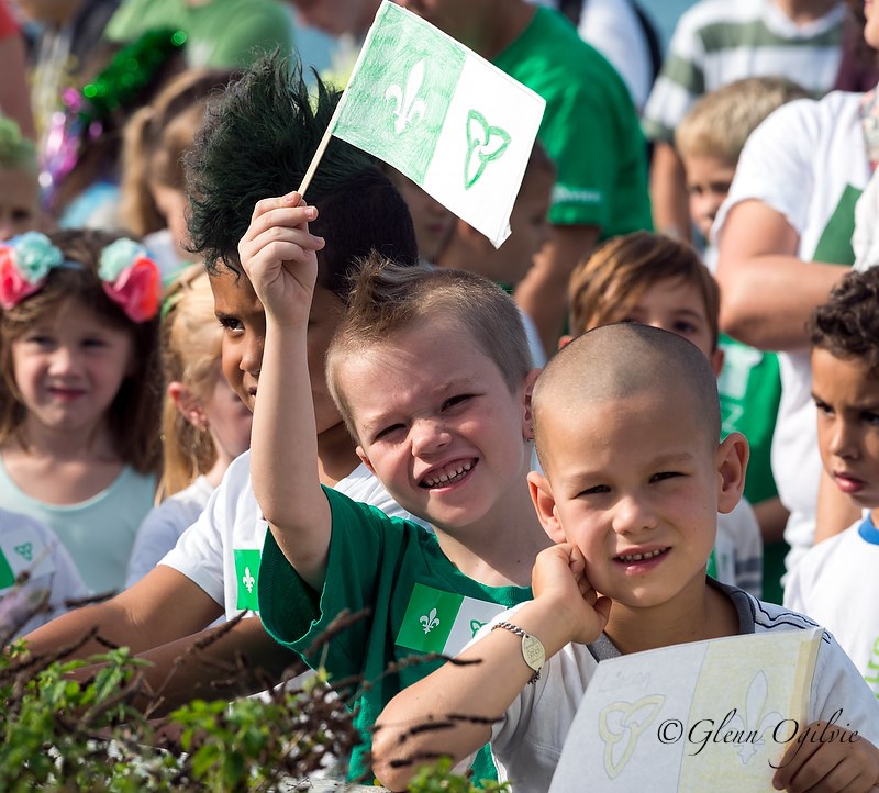 A.J. Mumby, left, and Lincoln Willemson, of St-Thomas-d'Aquin, were among those who joined the raising of the Franco-Ontarian flag ceremony on the waterfront. Glenn Ogilvie  