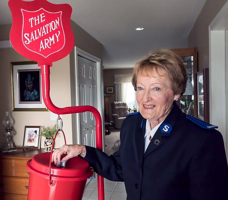 Margo Brett with Salvation Army donation kettle.