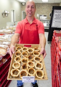 John Dattolo holds a tray of butter tarts at the new Dattolo’s Baked Goods on Confederation Street. Cathy Dobson